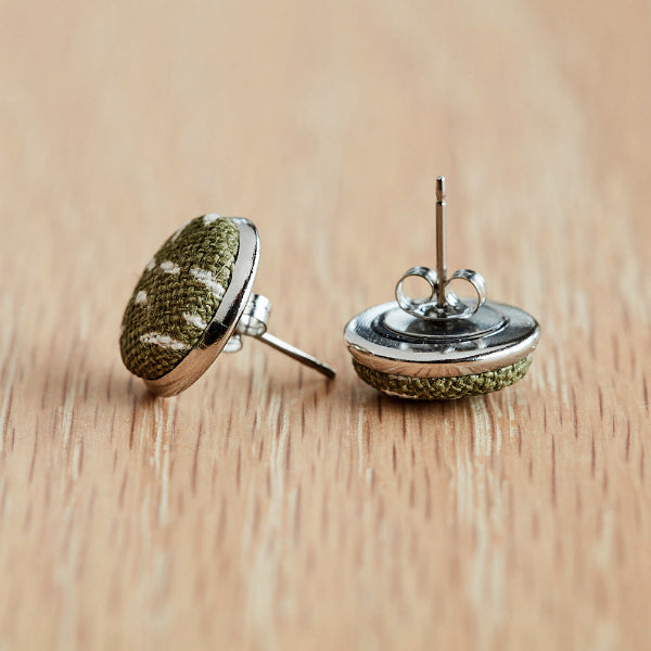 Pair of stud earrings with textile tops and stainless steel bases for reference