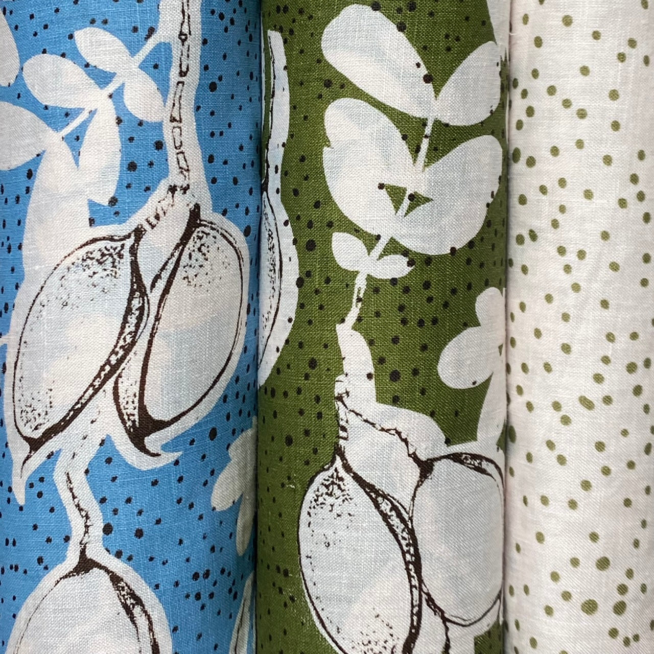 Seed pods in olive on shell pink linen